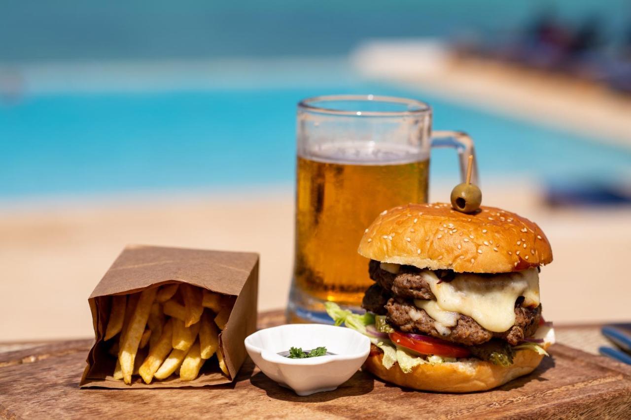Hotel Nungwi Dreams By Mantis Esterno foto A cheeseburger with chips and a beer