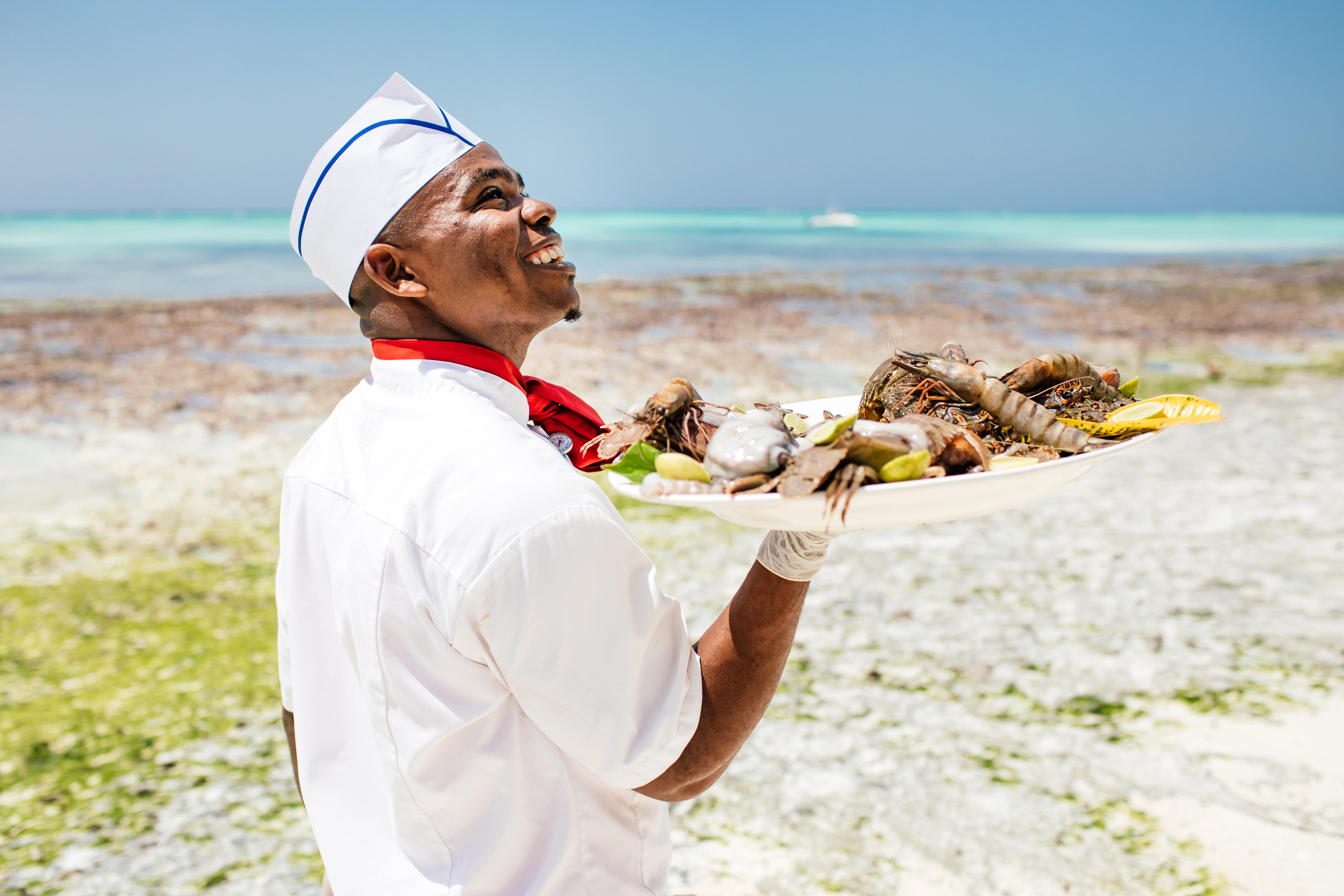 Hotel Nungwi Dreams By Mantis Esterno foto A chef at the beach